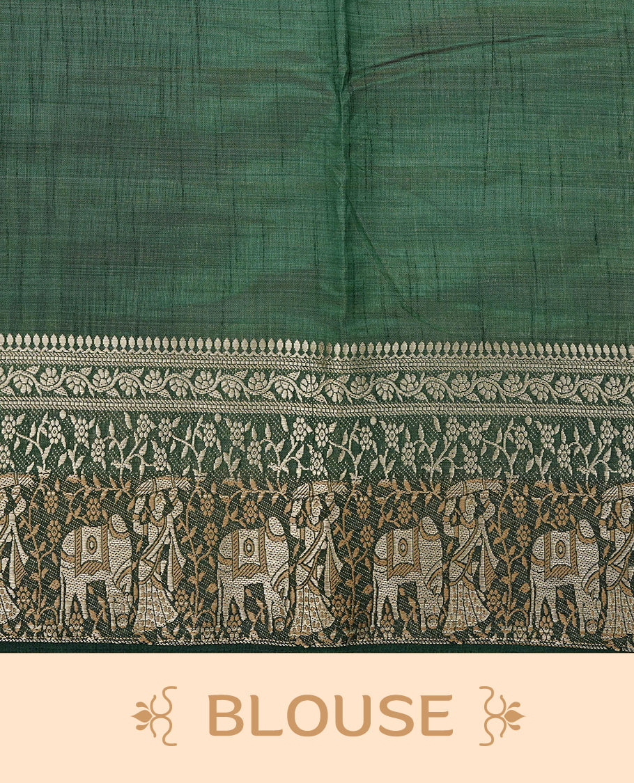 Light gold tussar saree featuring Elegant plain body, complemented by contrast dark green colour with Gold zari Floral kodi with Elephant Pattern border, comes with matching blouse piece.