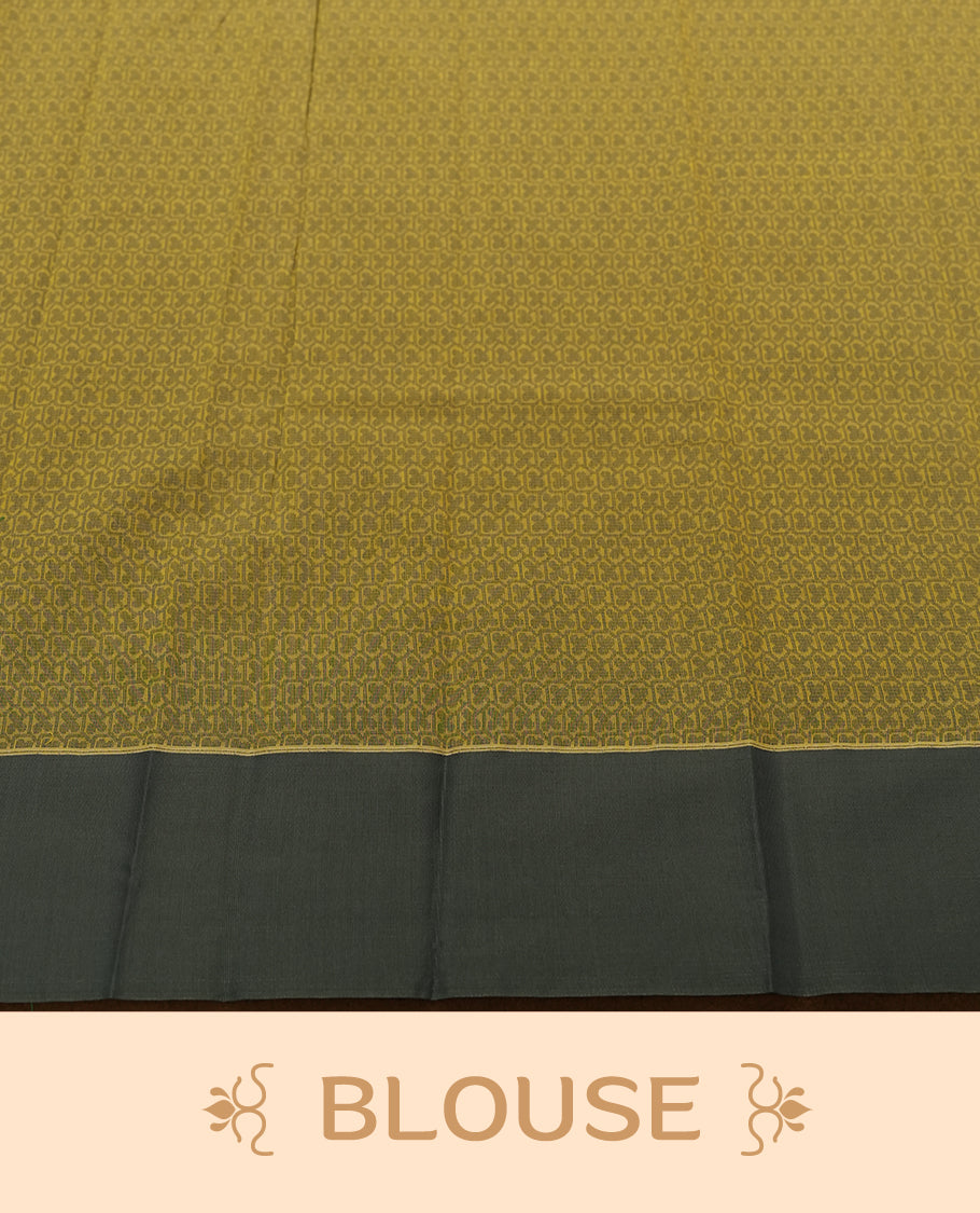Chrome yellow colour silk cotton saree featuring elegant floral zari motifs on the body, complemented by a rich contrast dark plain grey border and pallu with traditional woven detailing & Comes with a matching blouse piece.
