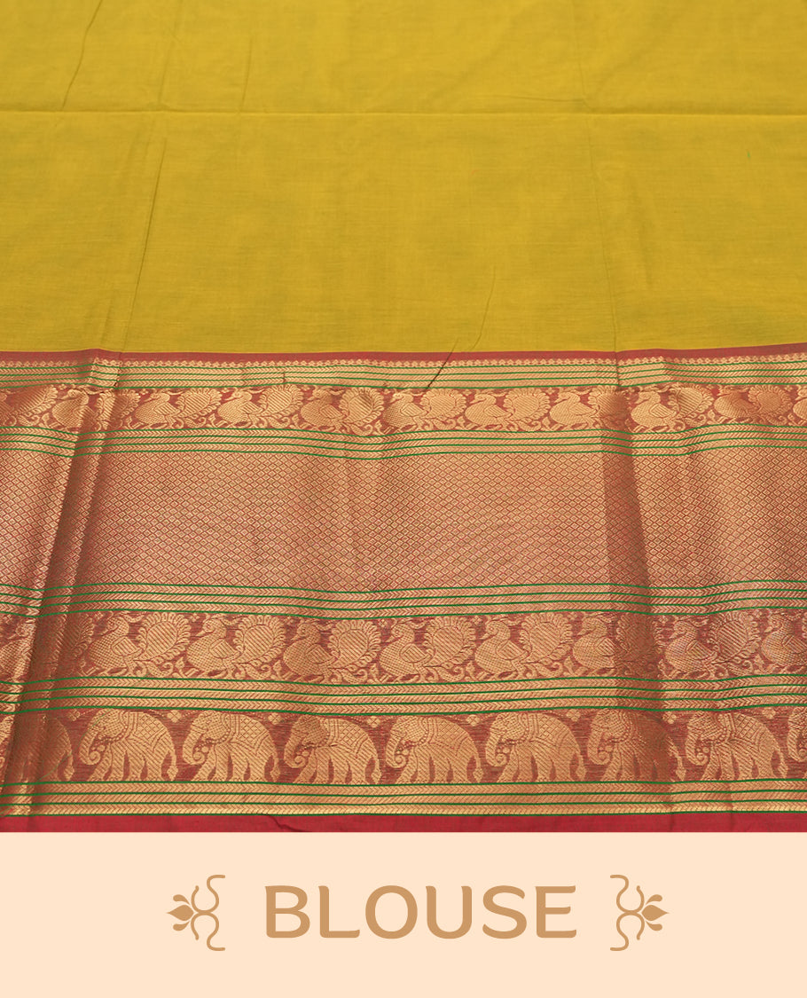 Olive Yellow Colour silk cotton saree with rich temple-red zari border featuring peacocks and elephant motifs, subtle gold-striped pallu, and a coordinated Olive Yellow blouse with matching zari border.
