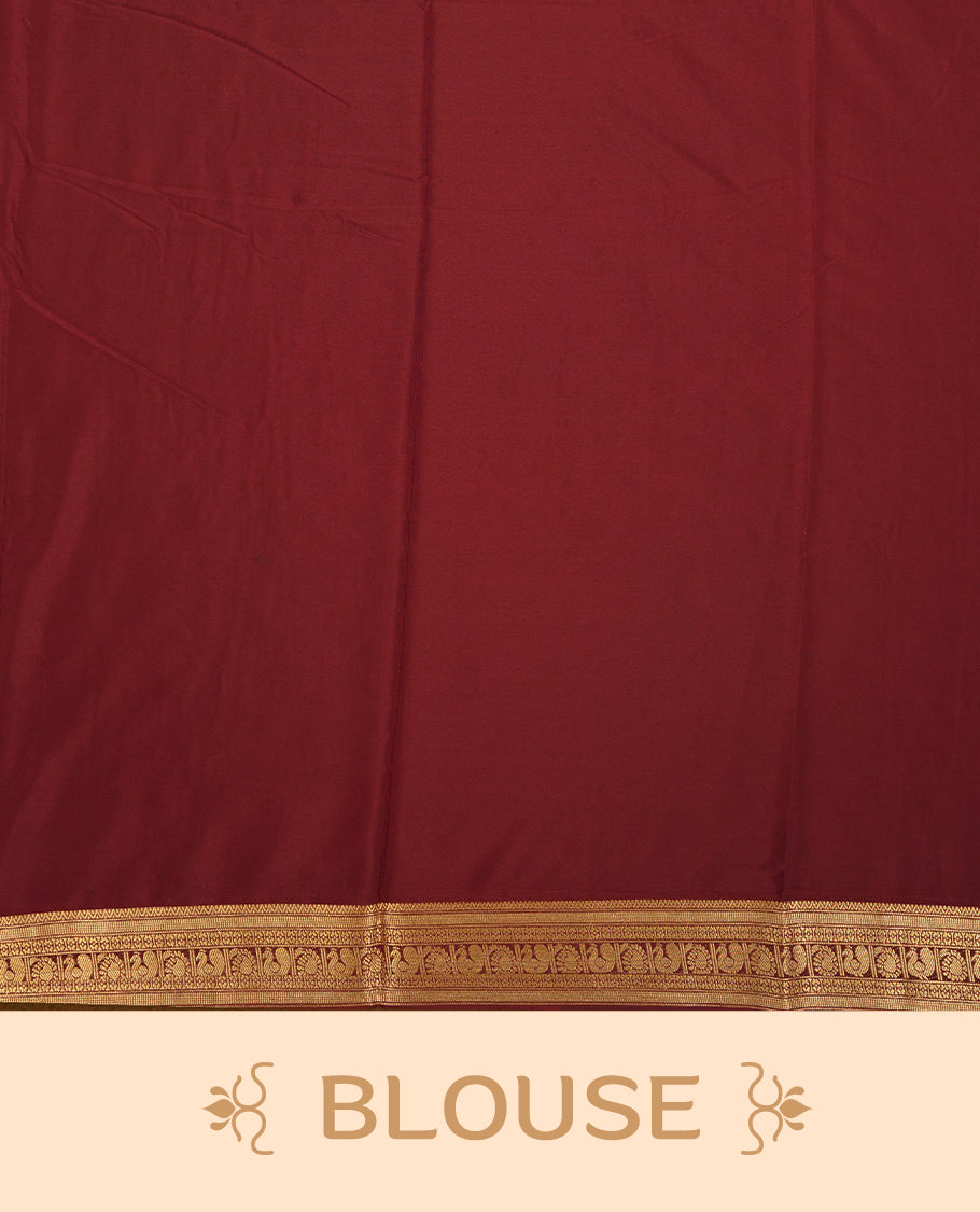 Orange colour mysore crepe saree with gold zari check pattern on body, complemented by contrast Chocolate brown colour border featuring peacock and chakkram motifs, paired with matching blouse.