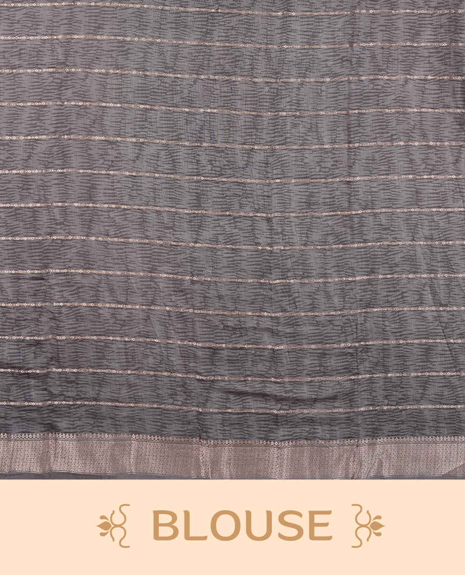 Black colour chanderi silk saree with gold zari strip pattern On body, compilmented by self colour border with antique zari pattern & white animal & forest print pattern and a matching blouse.