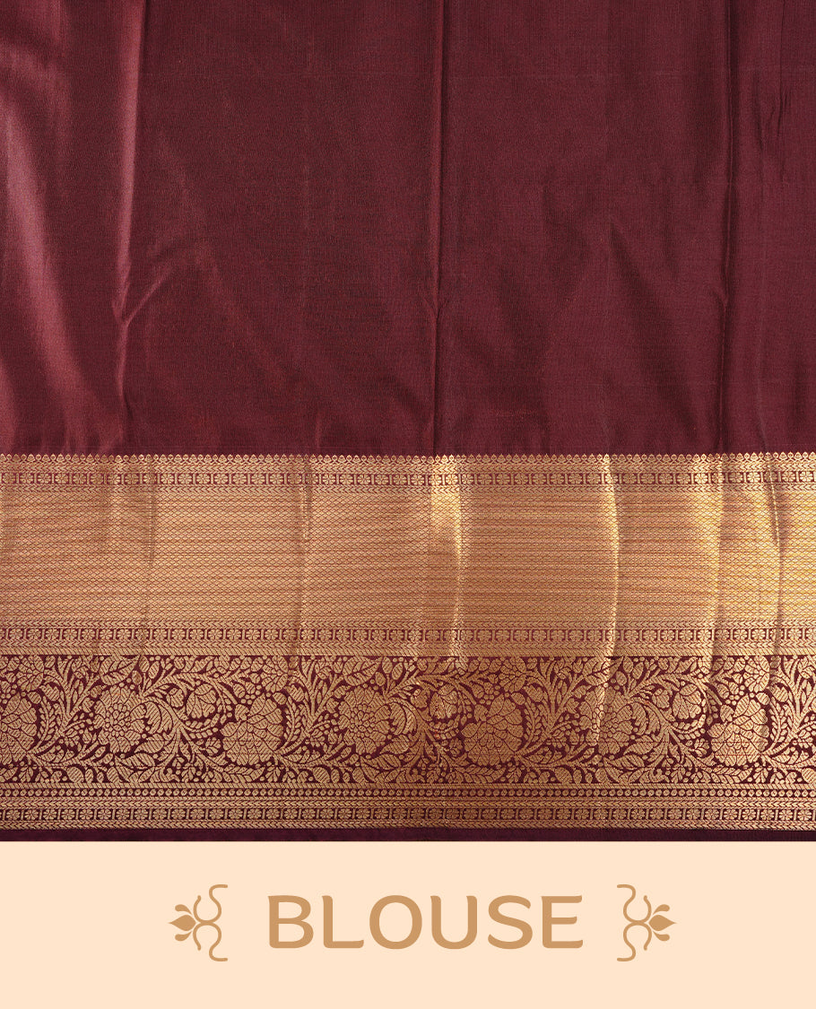 Brown colour semi wedding saree featuring gold zari motif on check pattern on body, complemented by contrast burgundy with traditional border, paired with matching blouse piece.