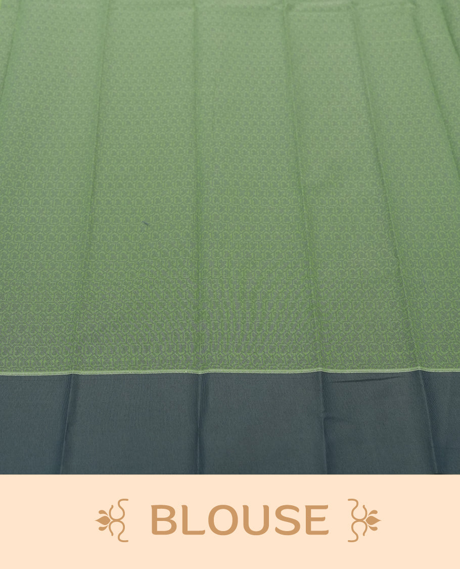 Moss green colour silk cotton saree featuring elegant floral zari motifs on the body, complemented by a rich contrast dark plain border and pallu with traditional woven detailing & Comes with a matching blouse piece.