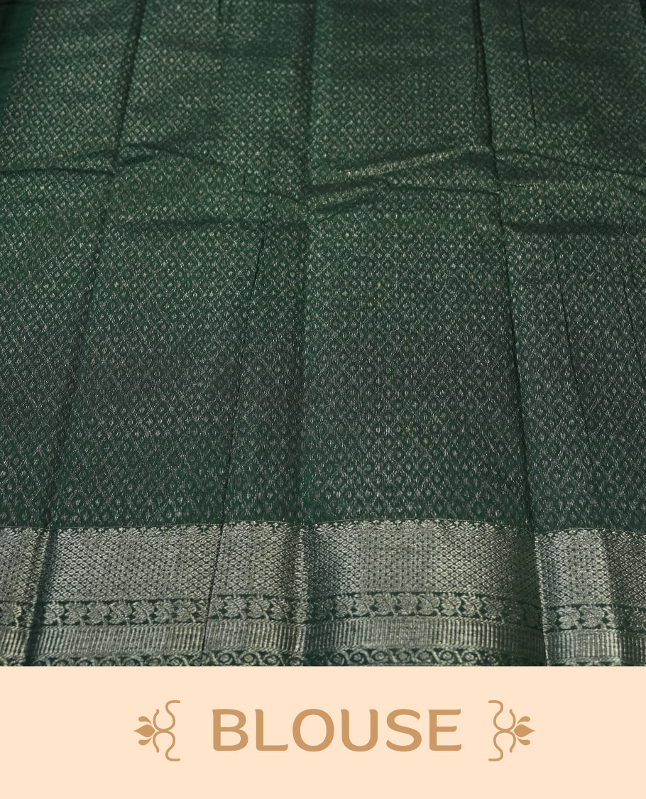 Dark green colour silk cotton saree with shimmering silver zari border and intricately woven pallu, blending elegance and tradition, Paired with a matching blouse, perfect for festive celebrations and special occasions.