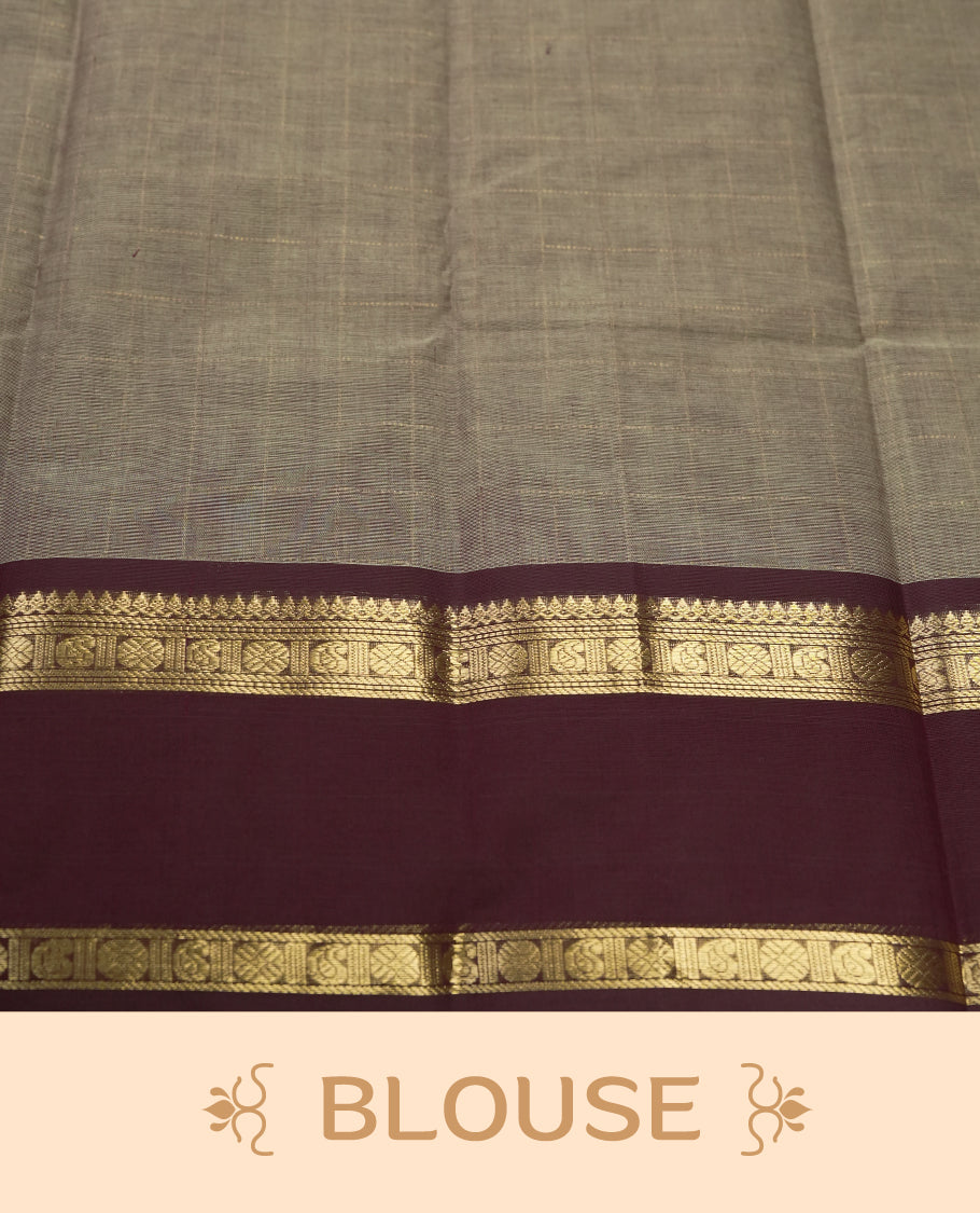 Grey colour Pure Kanchi cotton saree adorned with golden checks, complemented by a rich maroon zari border, paired with a matching blouse & A timeless blend of tradition and elegance, perfect for festive and casual wear.
