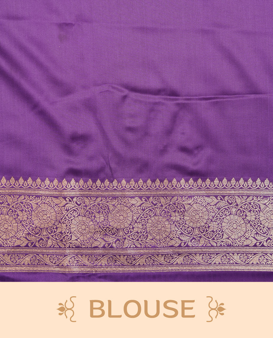 Purple colour Banaras Satin Crepe saree featuring gold zari floral motifs on the body, a richly woven traditional border with intricate gold zari detailing, and paired with a matching blouse.