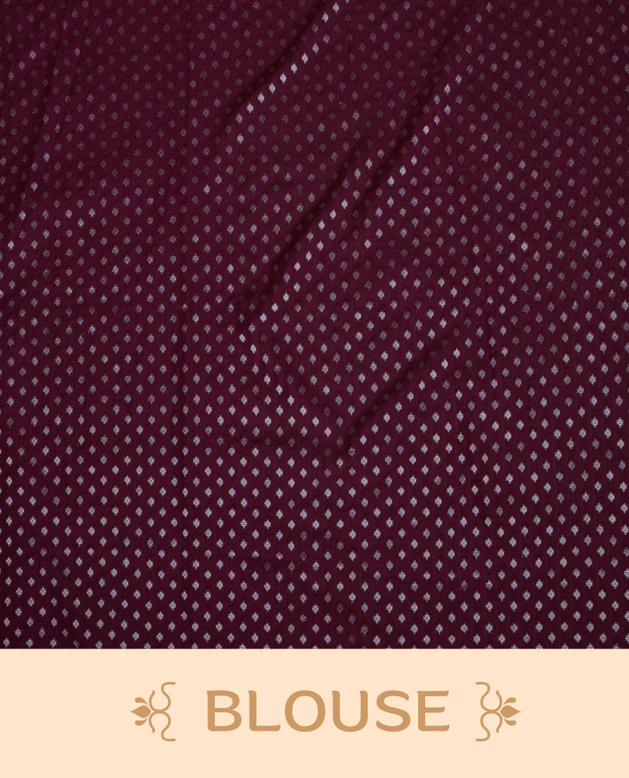 Wine colour Banarasi silk saree featuring intricate zari weaving and a soft silk texture, Adorned with silver motifs on the body, complemented by a rich Banarasi border and pallu & Comes with a matching blouse.