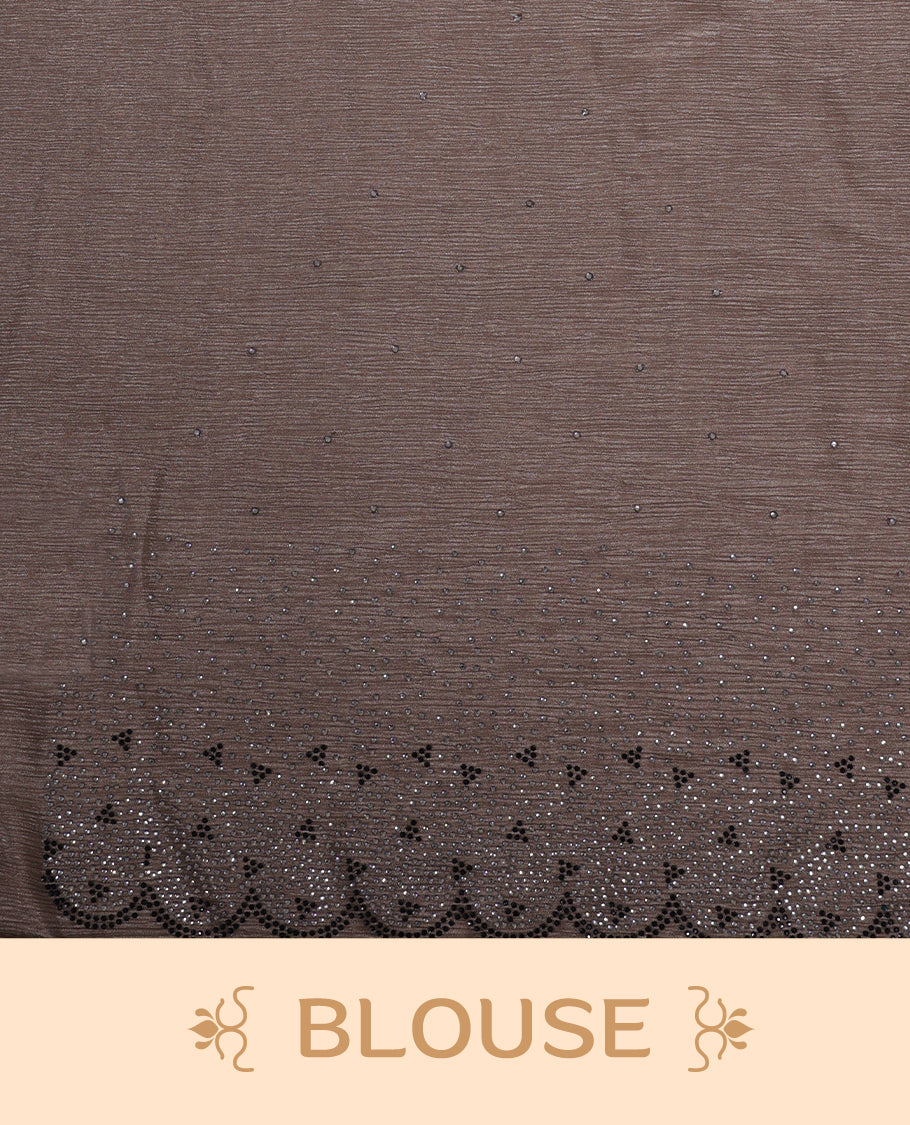 Dusty brown colour chiffon designer saree, featuring black and white scattered stone on body, stone work and heavy stone pattern on border and pallu, Paired with matching blouse.