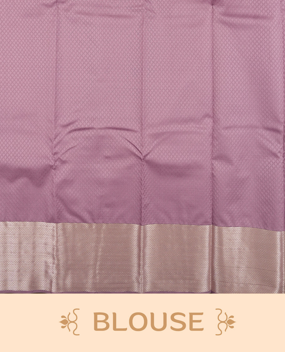 Purple Lavender colour semi soft silk saree featuring a self coloured textured patterned body, complemented by self coloured silver motifes on pallu & border and a matching blouse piece.