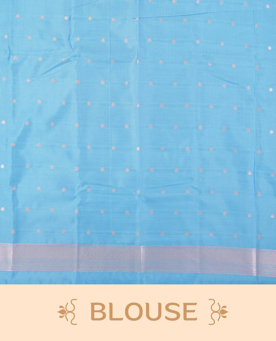 Sky blue semi silk saree featuring elegant circular motifs on the body, complemented by a striking pallu adorned with intricate wavy white thread patterns with golden border, and paired with a matching blouse