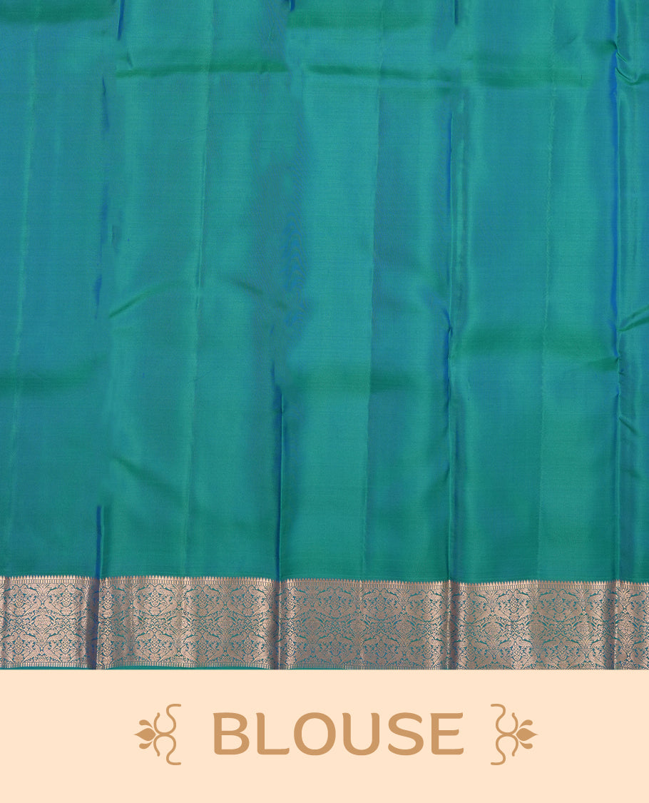 Peacock green colour Vasundhara silk saree adorned with all-over gold chakkaram& mayil motifs on the body, complemented by a self colour with rose gold traditional border and paired with a matching blouse piece.