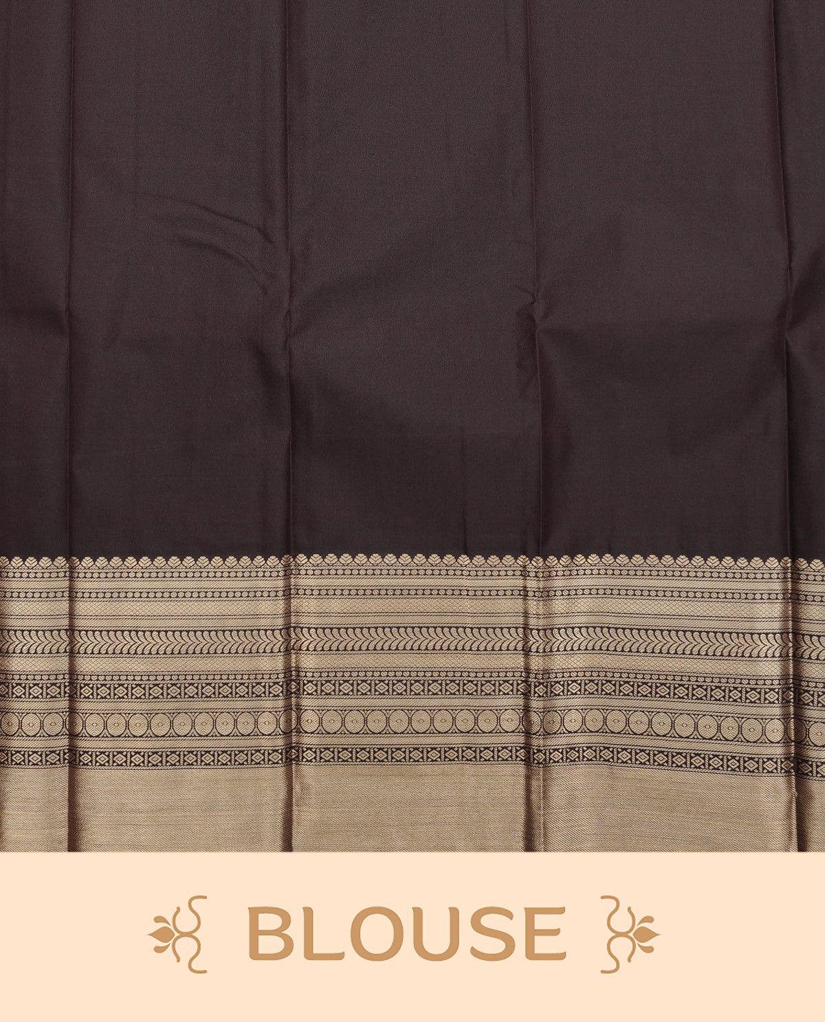 Dark chocolate colour soft silk saree featuring gold zari floral motifs on body, contrast self colour gold zari traditional border, grand pallu comes with matching blouse piece.