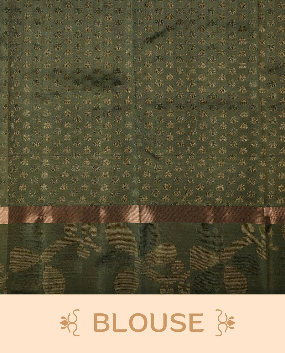 Light gold colour soft silk saree featuring gold zari motifs on the body, complemented by a contrast green zari floral kodi border and pallu, paired with a matching blouse piece.