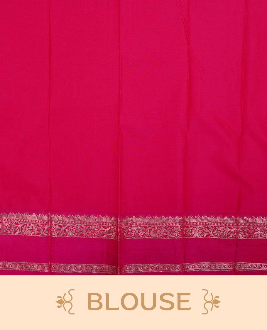 Lemon coloured soft silk saree featuring gold zari stripes and motifs across the body, enhanced with a contrast rani pink border and pallu, paired with a matching contrast blouse piece