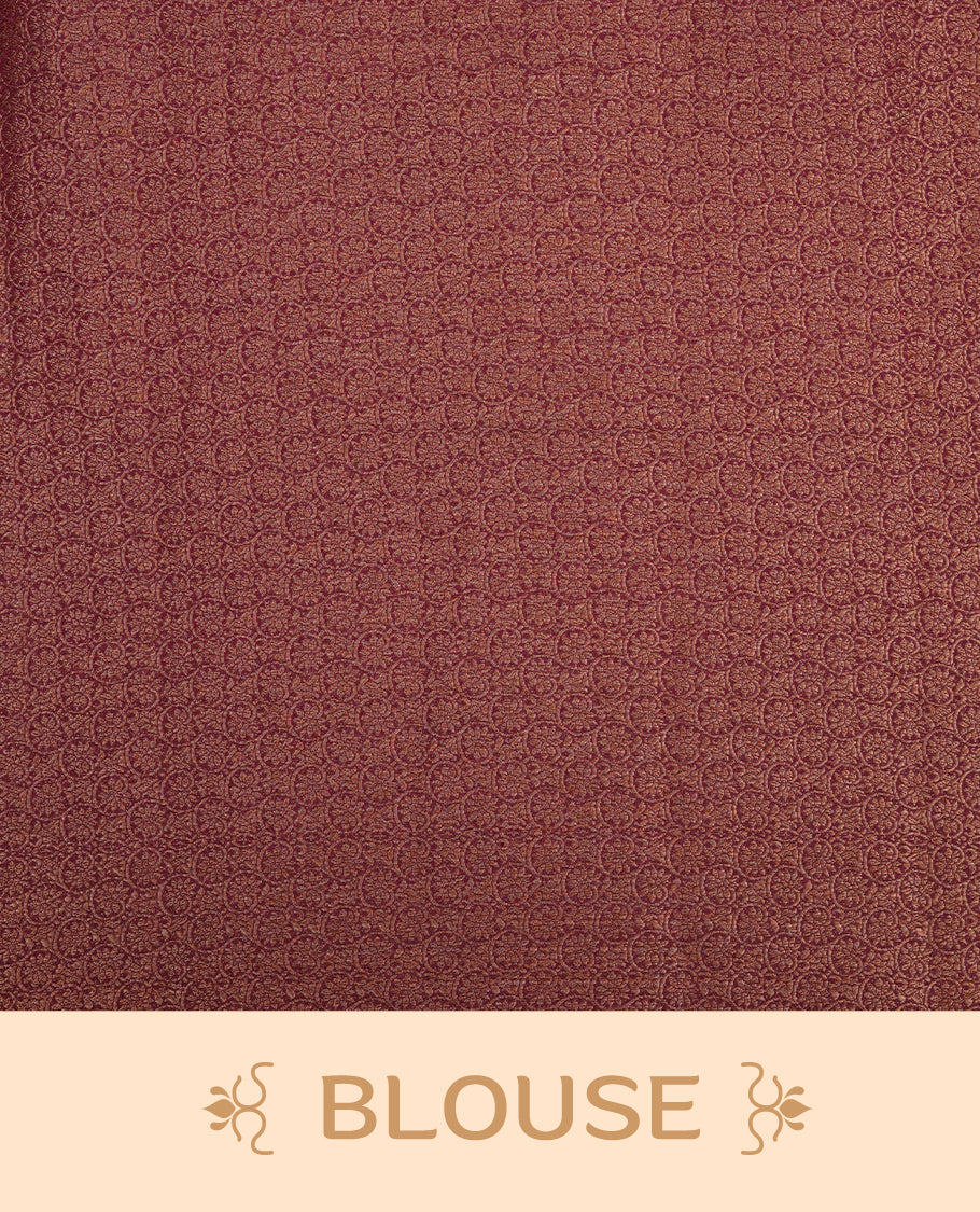 Burnt orange colour semi linen silk saree featuring antique zari motifs on body, traditional border with contrast maroon colour, pallu and paired with matching blouse