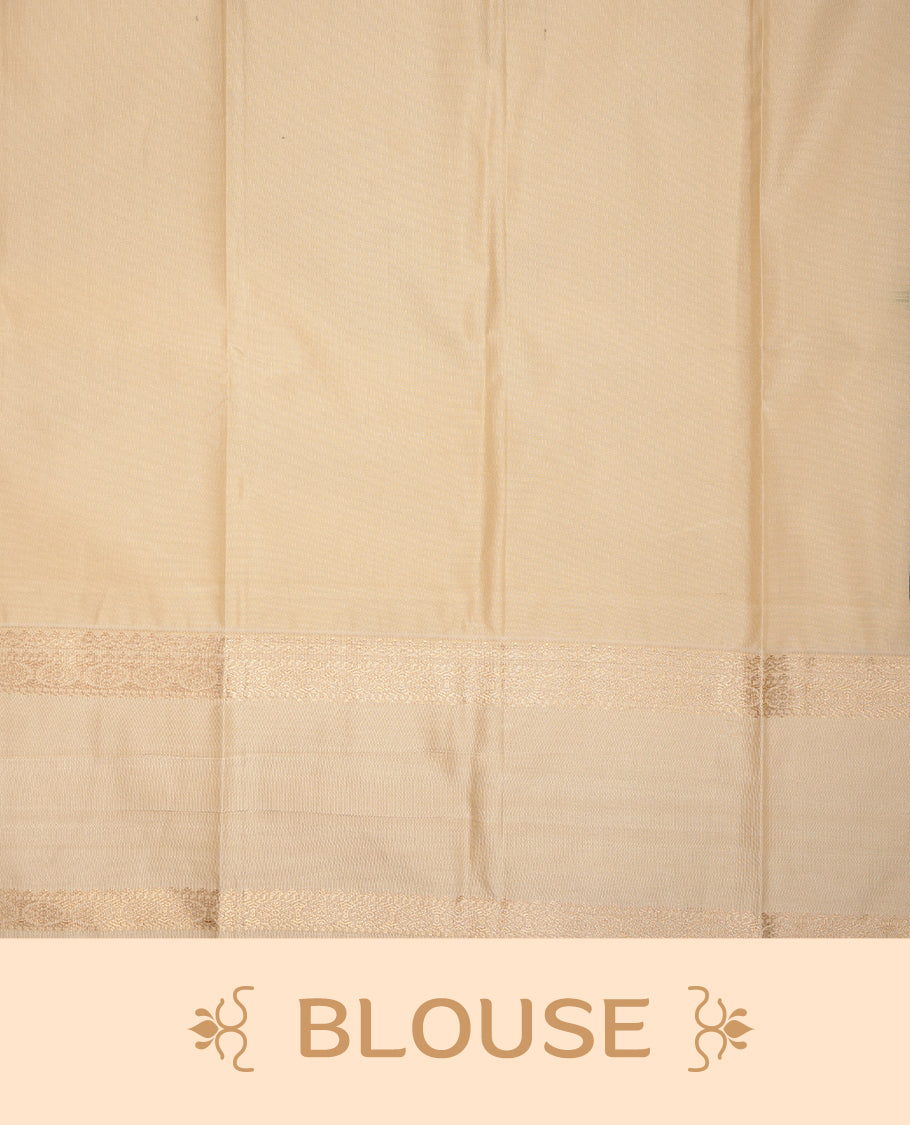 Dark green coloured soft silk saree featuring gold zari stripes and motifs across the body, enhanced with a contrast cream border and pallu, paired with a matching contrast blouse piece.