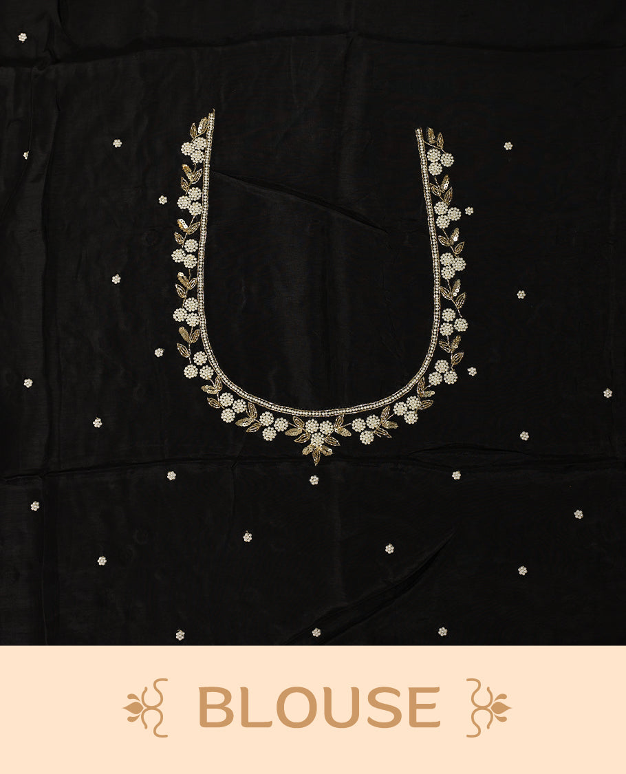 Black pure crepe saree featuring vibrant multi colour floral prints, adorned with delicate cut beads and pearl work along a scalloped border, paired with a matching blouse.