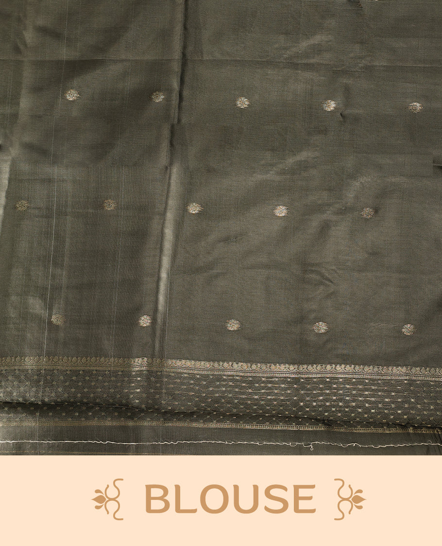 Golden Peach colour saree featuring subtle self striped woven patterns on the body, enhanced with a olive green geometric border, complemented by a rich zari pallu with tassels, and paired with a matching blouse for a traditional elegant look.