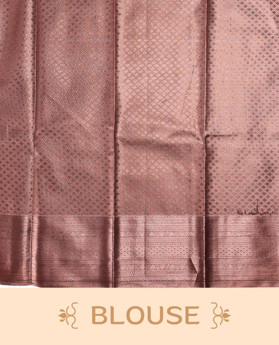 Copper brown semi silk brocade saree adorned with subtle self brocade patterns and a sleek matching woven border and pallu, Comes with a coordinated blouse, perfect for understated traditional elegance.