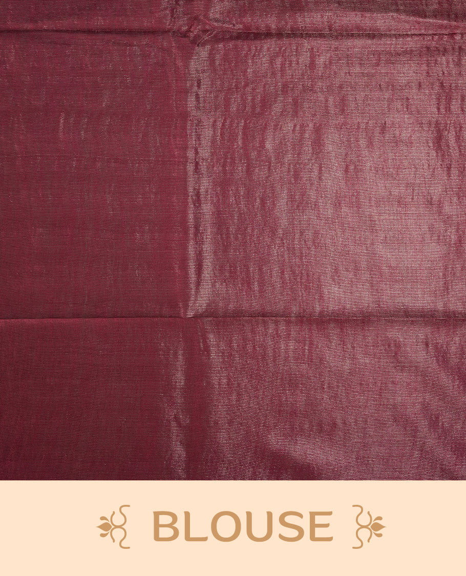 Burgundy brown colour semi jute tissue saree featuring delicate wave motifs on the body, complemented by a lustrous zari striped pallu and matching blouse piece for a refined festive look.