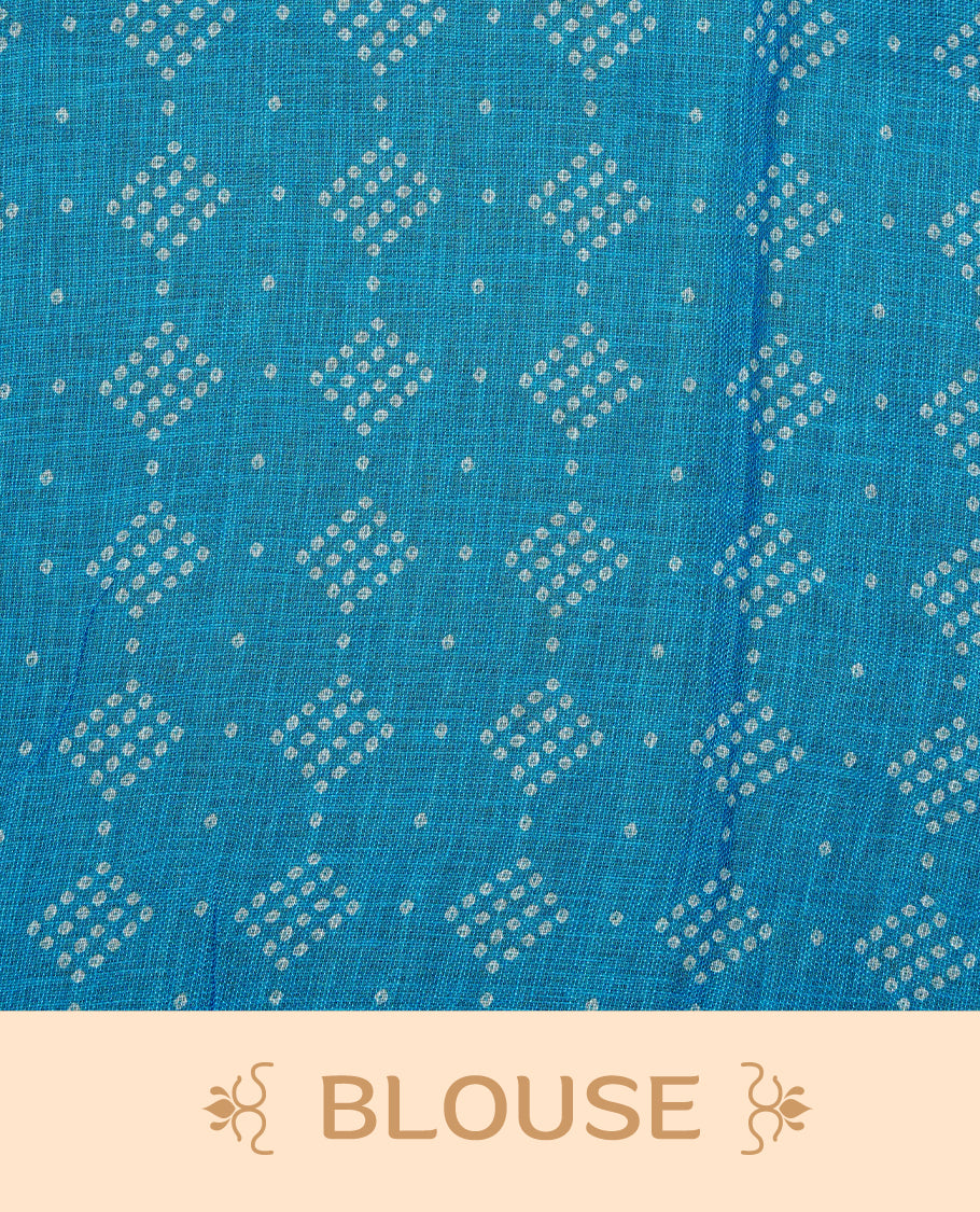 Cream colour semi linen saree featuring Blue Ajrakh pattern print on body, complemented by contrast Green colour with same pattern print Blue border, comes with matching blouse piece.
