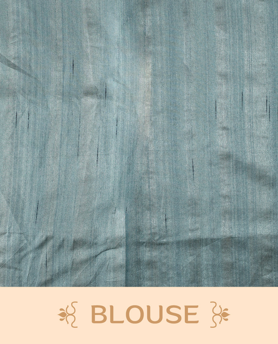 Teal colour semi tussar saree adorned with elegant white applique work in leaf and floral designs across the body and border, paired with a matching blouse.