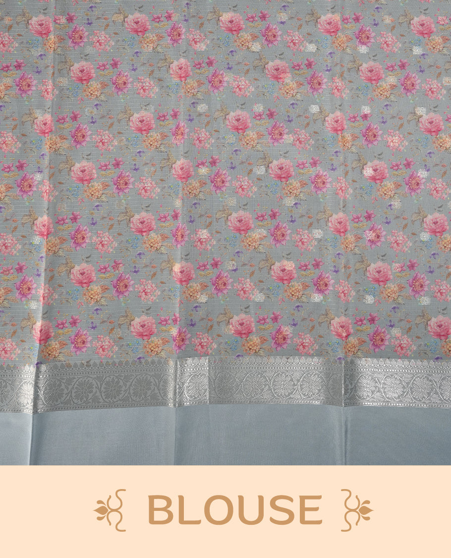 Ivory colour Kotta Tussar Silk saree features a vibrant digital floral print with small gold zari motifs on the body, and elegant grey colour banarasi border & Paired with a matching blouse,blending modern design with traditional elegance.