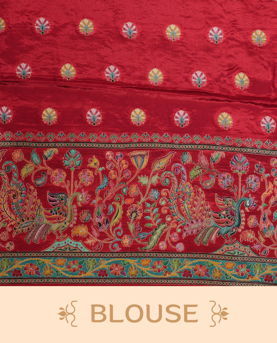 Cream colour Pashmina silk saree features an all over Multi colour box with motifs body, a contrast red peacock border and pallu, and a matching unstitched blouse.