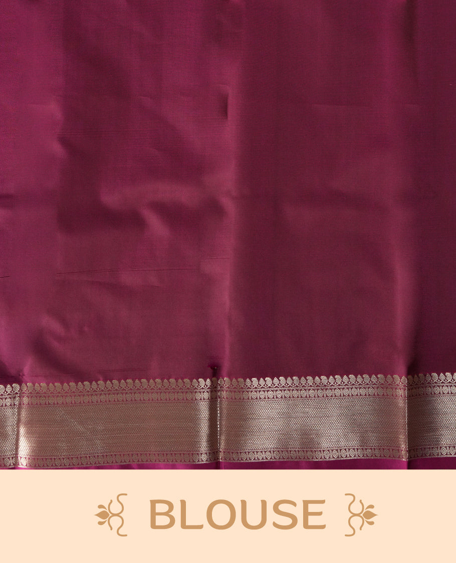 Mulberry colour soft silk saree featuring fawn gold colour buttas and a lustrous fawn gold colour zari border with matching pallu & Paired with a matching blouse.