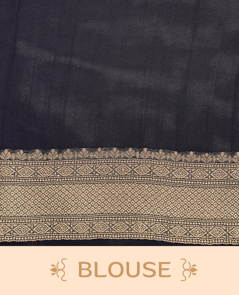 Dark Blue colour semi Banaras crepe silk saree featuring an elegant gold zari patterned body, highlighted by a plain border adorned with traditional gold zari cow motifs. Paired with a matching blouse piece.