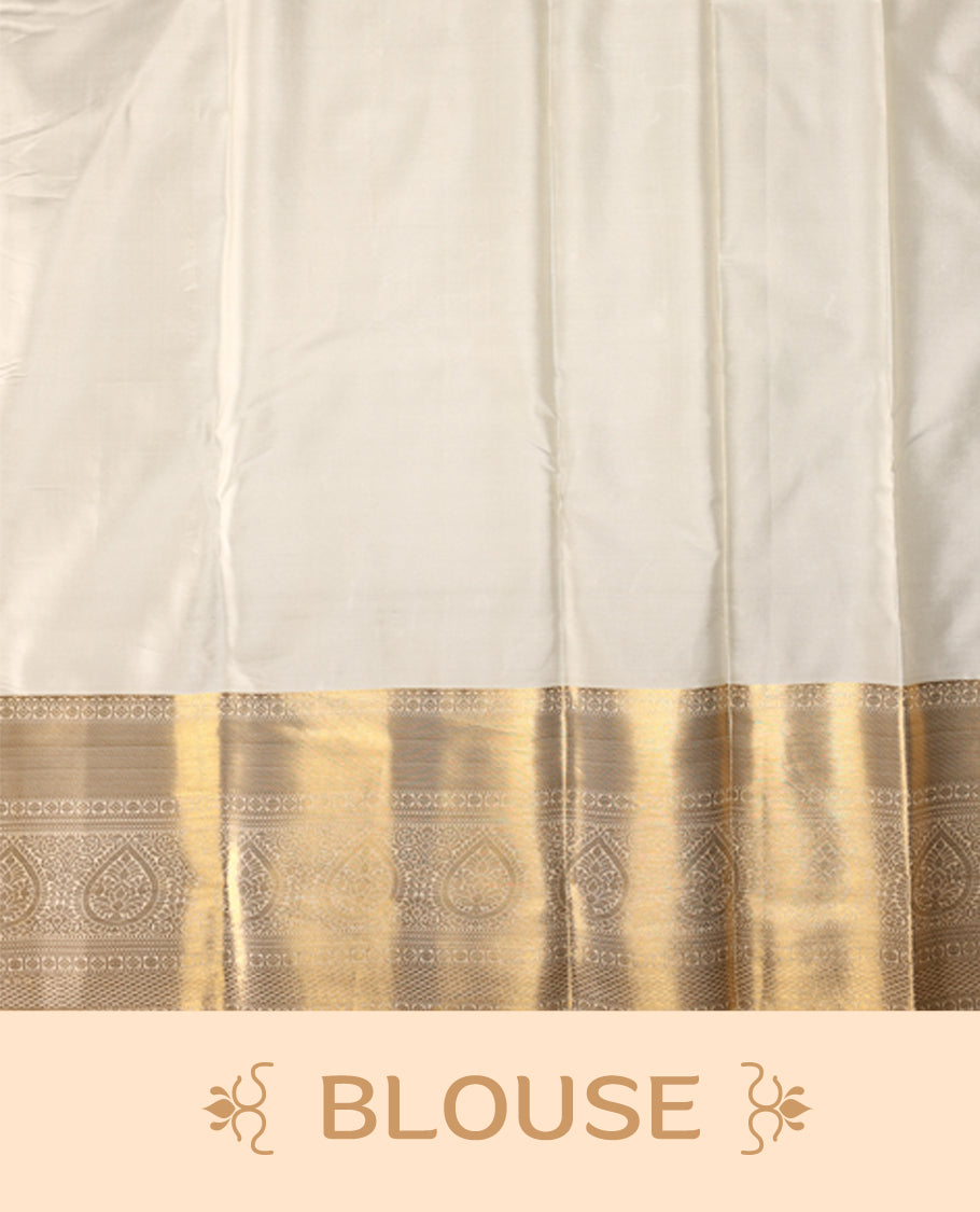 Ivory gold semi silk brocade saree with rich self brocade detailing across the body, paired with an opulent gold woven border and pallu. Comes with a matching blouse for a timeless traditional look.