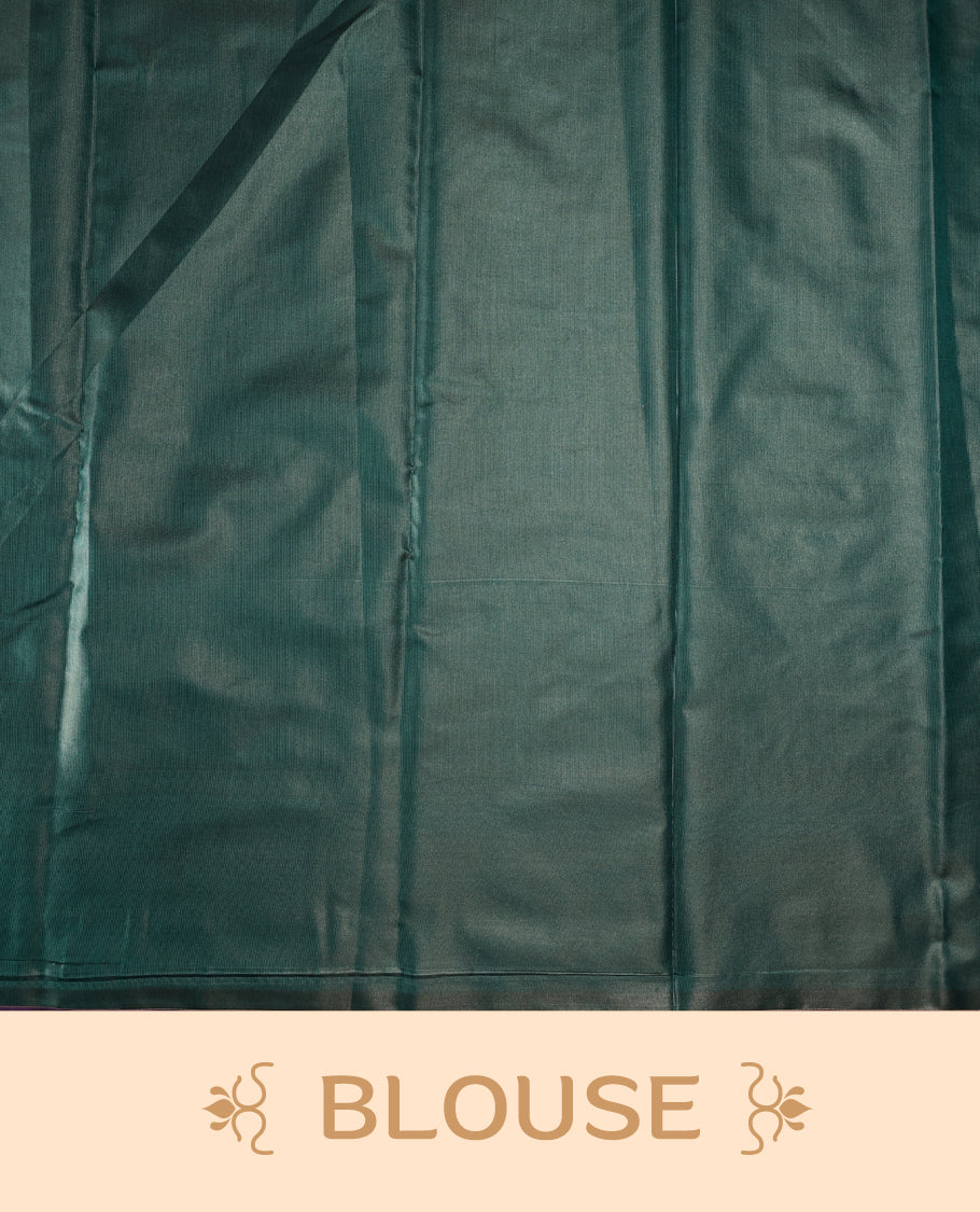 Teal green colour semi silk saree featuring elegant silver zari floral motifs across the body, complemented by a rich self-colour woven border and pallu, paired with a matching blouse.