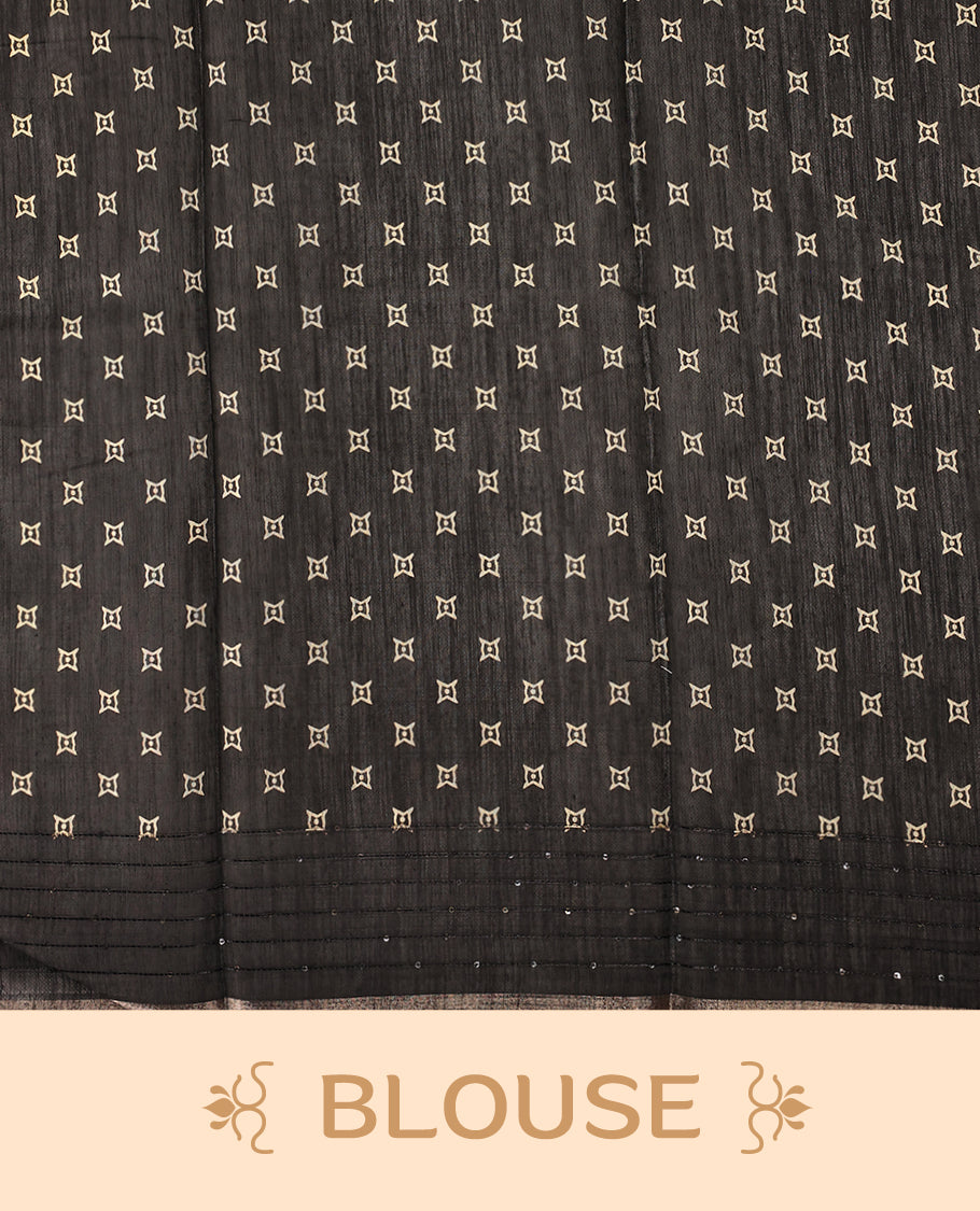 Black colour saree adorned with golden zig zag patterns across the body, complemented by a richly designed traditional pallu, and paired with a matching blouse
