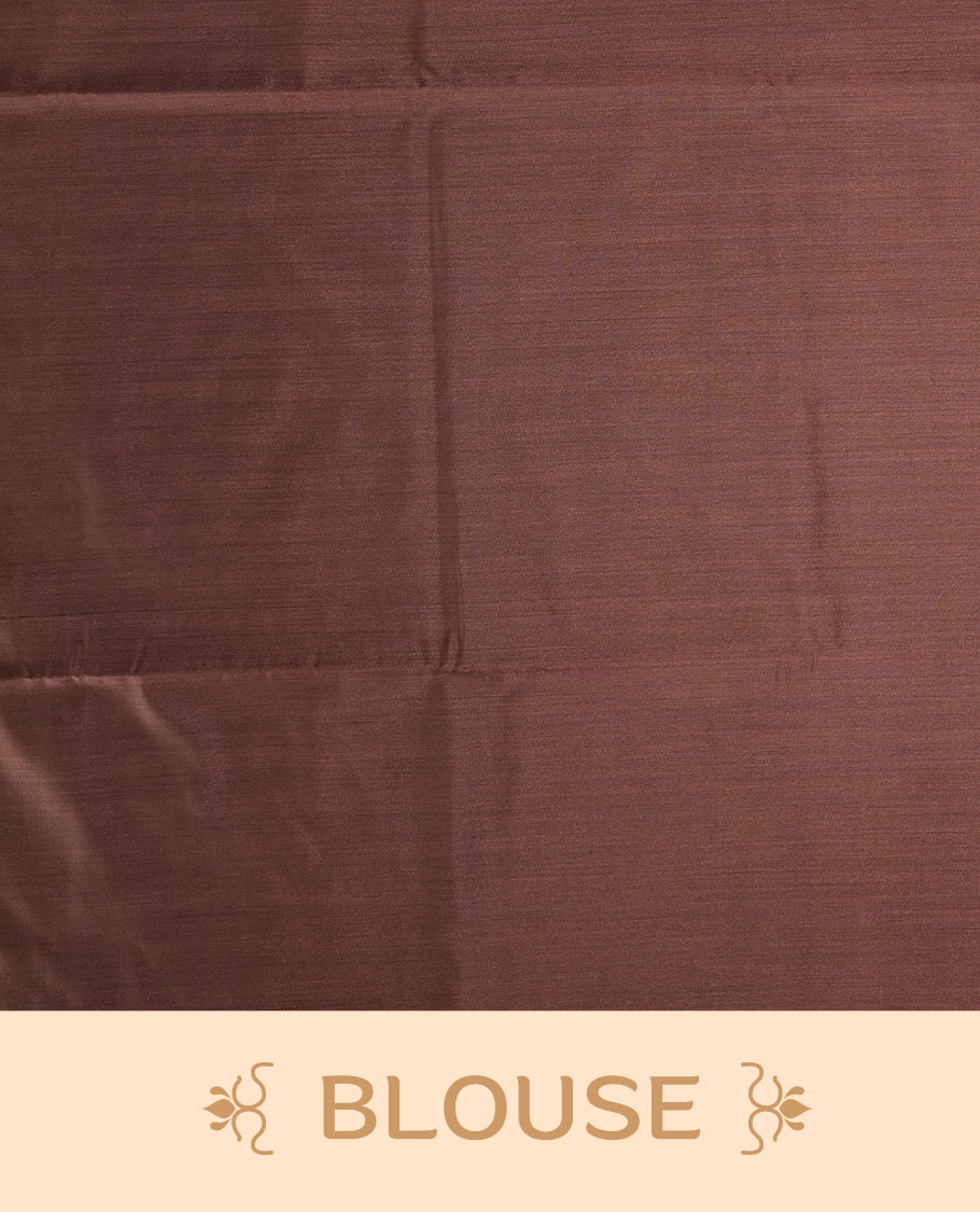 Brown colour semi soft silk saree with delicate woven motifs on the body, complemented by a beautifully designed pallu with tassels & Paired with a matching blouse piece, this drape exudes timeless elegance.