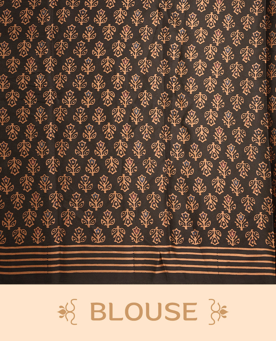 Black colour saree beautifully embellished with brick red woven palm tree and geometric motifs, featuring a rich patterned border and pallu, paired with a matching blouse.