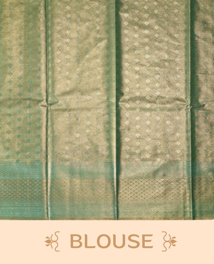 Green semi silk brocade saree featuring delicate self brocade motifs across the body, enhanced with a soft gold toned woven border and pallu, Includes a matching blouse for a graceful ethnic look.