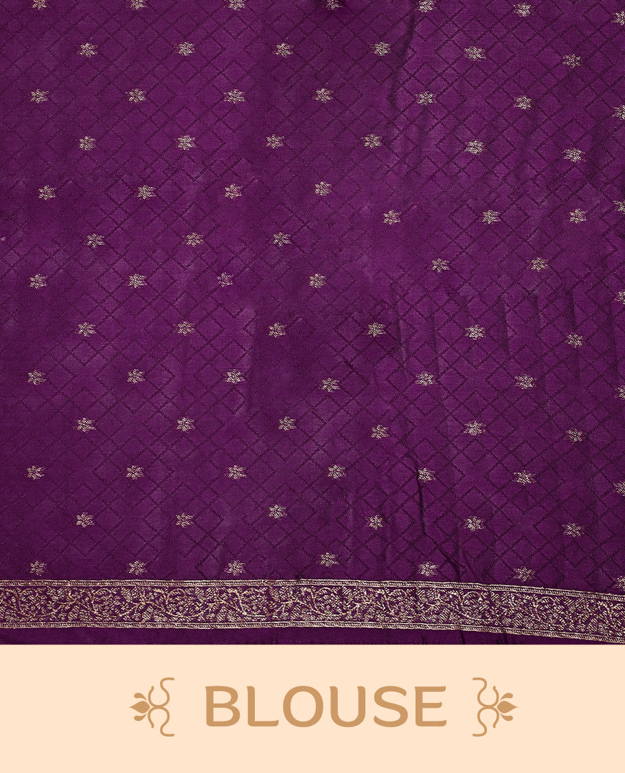 Deep purple semi Banaras tussar saree adorned with golden floral motifs in diagonal patterns across the body and a finely woven zari border, finished with a rich golden pallu, paired with a matching blouse.
