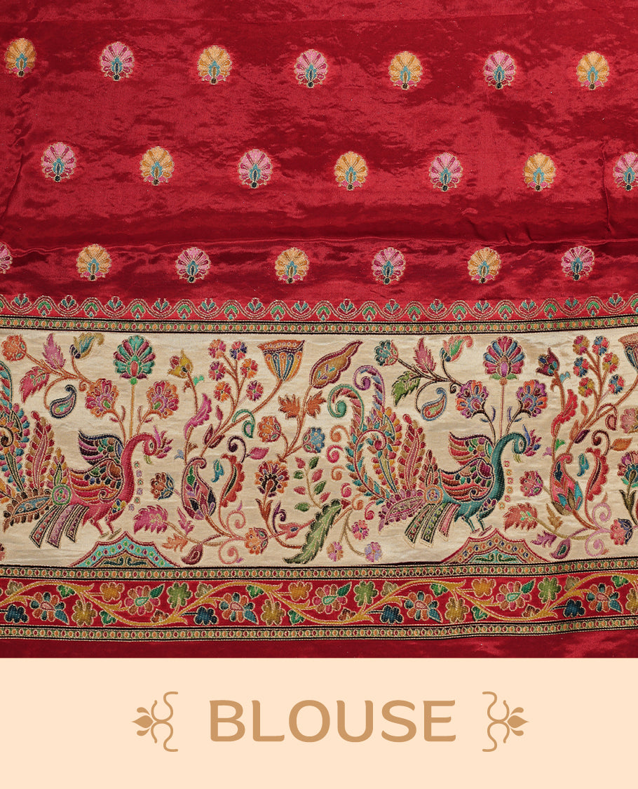 Pink colour Pashmina silk saree features an all over Multi colour box with motifs body, a contrast red floral kodi border and pallu, and a matching unstitched blouse.