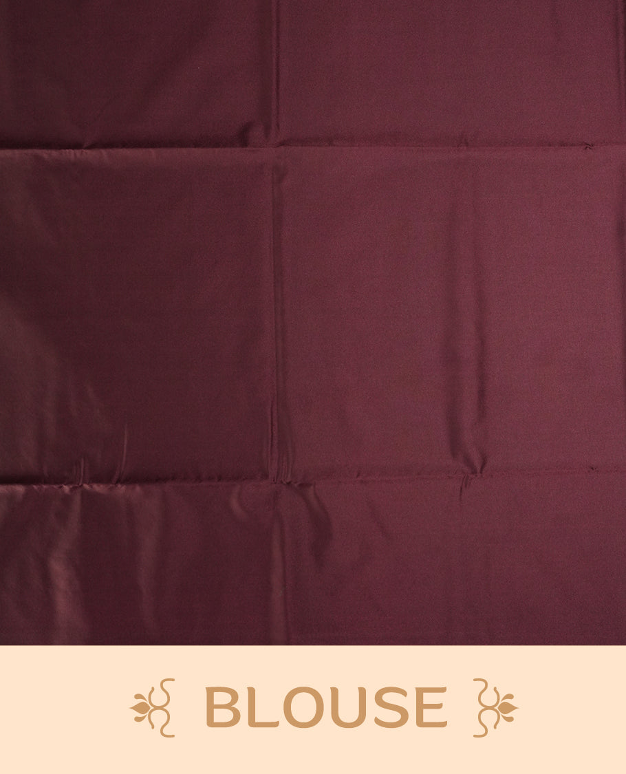 Deep brown colour semi soft silk saree, adorned with subtle floral woven motifs on the body & The design is elevated with an elegant zari border and pallu, paired with a matching blouse.