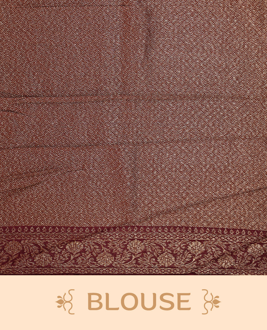Dark coffee brown colour semi Banaras tussar saree adorned with golden floral motifs along the border and scattered designs across the body, finished with a rich golden zari pallu, paired with a matching blouse.