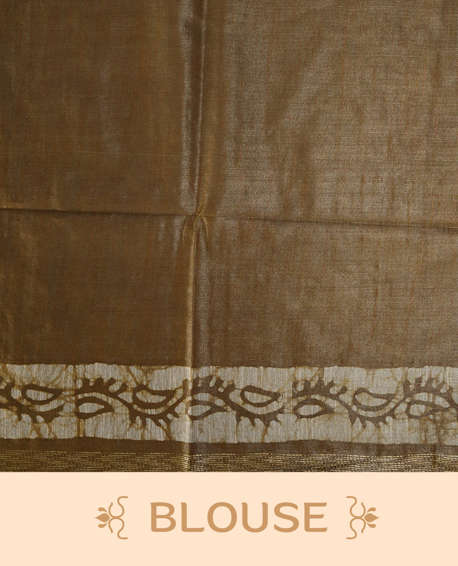 Golden brown semi jute tissue saree featuring elegant floral motifs all over the body, complemented by a shimmering zari striped pallu, woven golden border, and matching blouse piece for a graceful look.