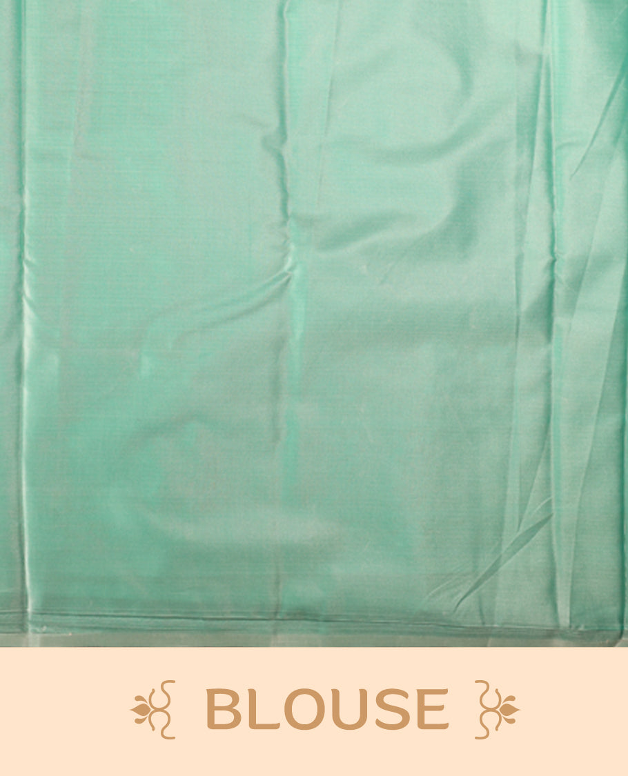 Sea green colour semi silk saree featuring delicate golden zari floral motifs across the body, complemented by a rich self colour woven border and pallu, paired with a matching blouse.