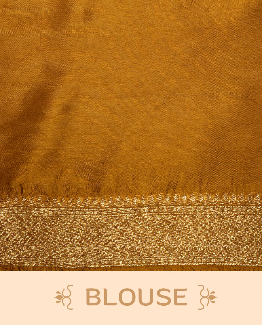 Dark Mustard colour Semi Banaras Tussar Georgette Featuring Gold zari Leaf pattern on body, Finished with Gold zari border and paired with matching blouse piece.