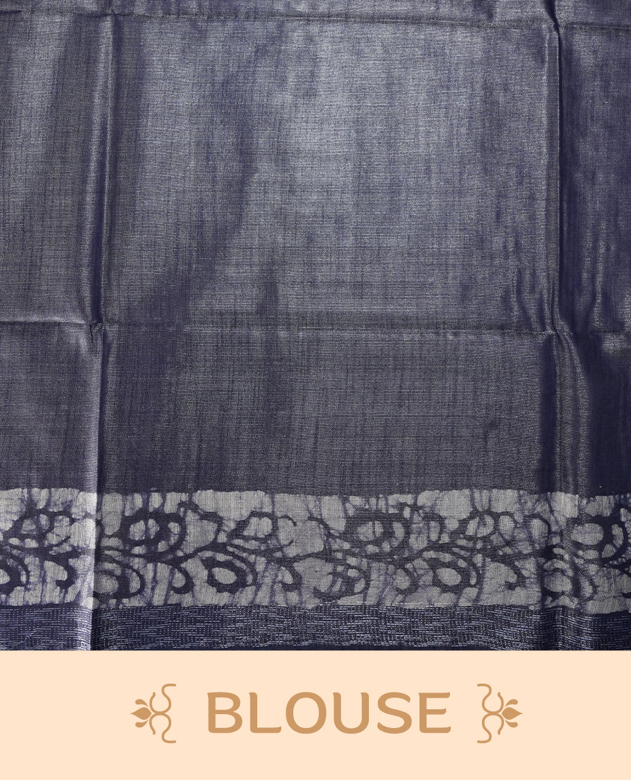 Greyish blue colour semi jute tissue saree featuring white floral prints across the body, adorned with intricate geometric woven borders and a graceful floral work pallu & Comes with a matching blouse piece.