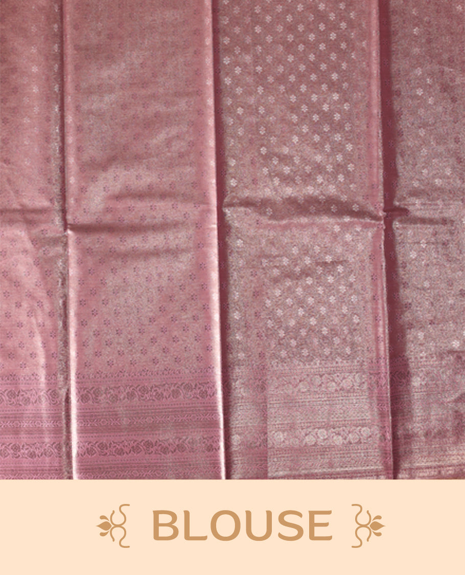Baby pink colour semi silk brocade saree featuring delicate self design brocade patterns across the body, complemented by a rich self colour woven border and pallu, paired with a matching blouse.