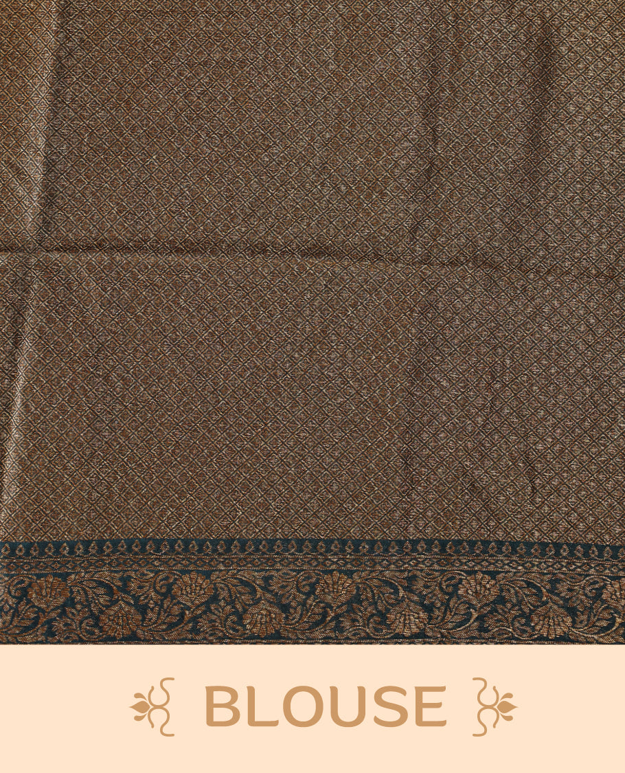 Dark teal green semi Banaras tussar saree adorned with golden floral motifs along the border and scattered designs across the body, finished with a rich golden zari pallu, paired with a matching blouse.