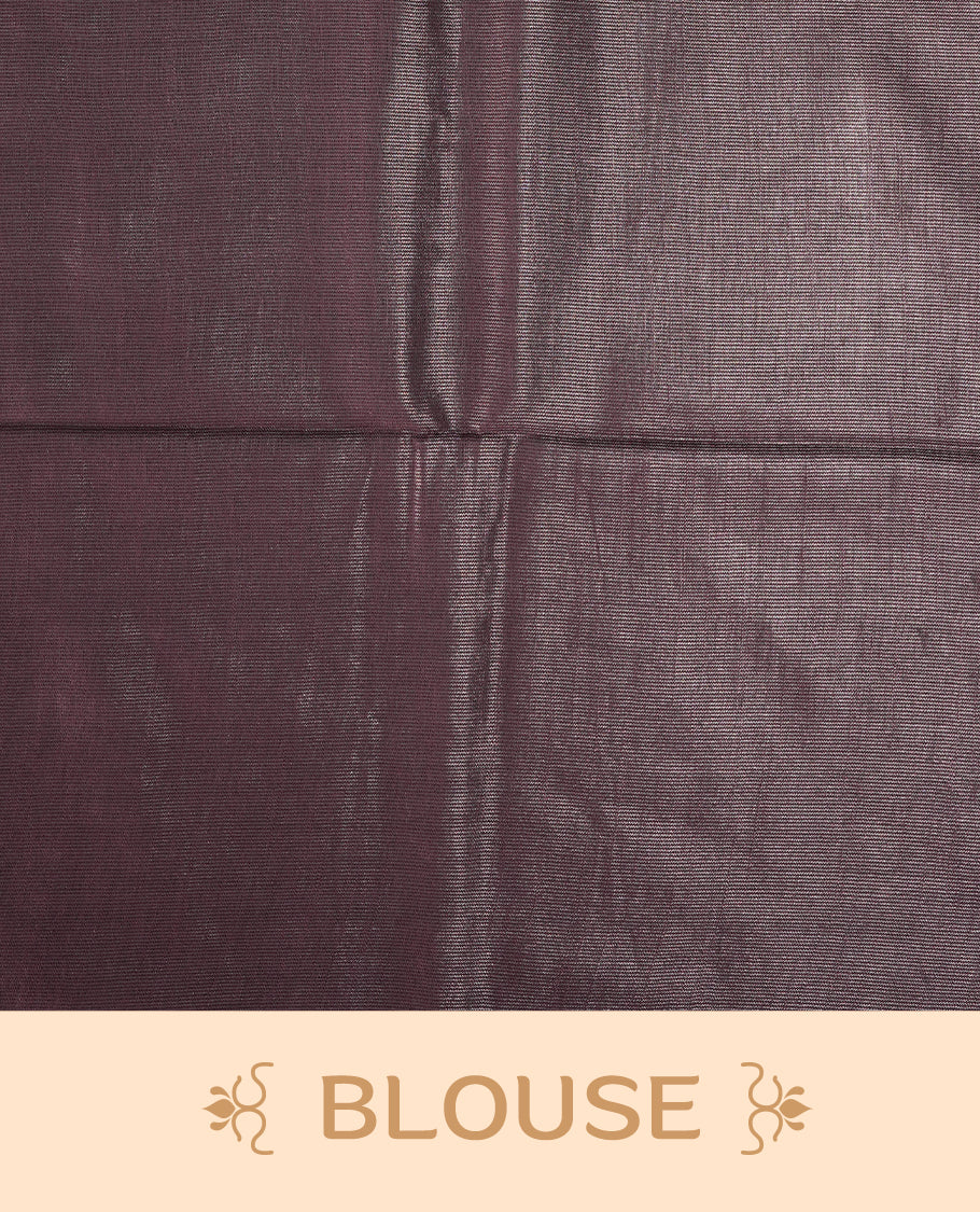 Mauve semi jute tissue saree featuring subtle dotted woven patterns on the body, complemented by a shimmering pallu and sleek zari border & Comes with a matching blouse piece for a complete look.