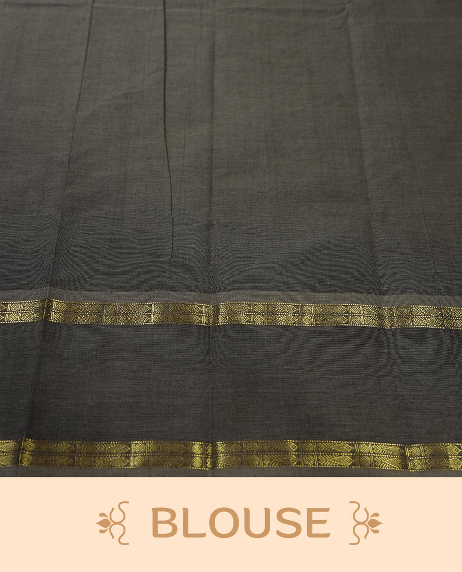 Grey colour Pure Kanchi cotton saree adorned with subtle golden buttas all over, highlighted by a rich zari woven border with traditional motifs & Includes a matching blouse piece for a complete look.
