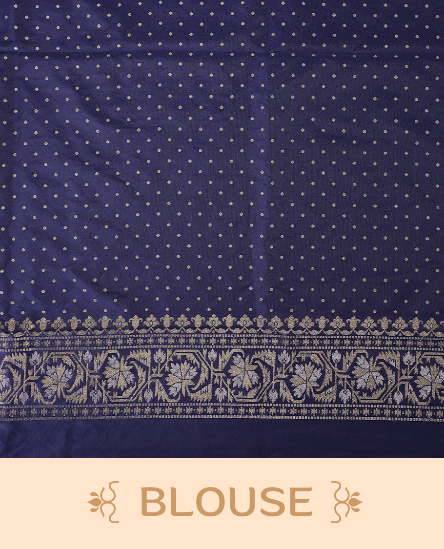 Graceful navy blue Banaras soft silk saree with gold zari buttas on the body, intricate floral zari border, grand pallu with paisley motifs, and a matching blouse. Perfect for weddings and celebrations.