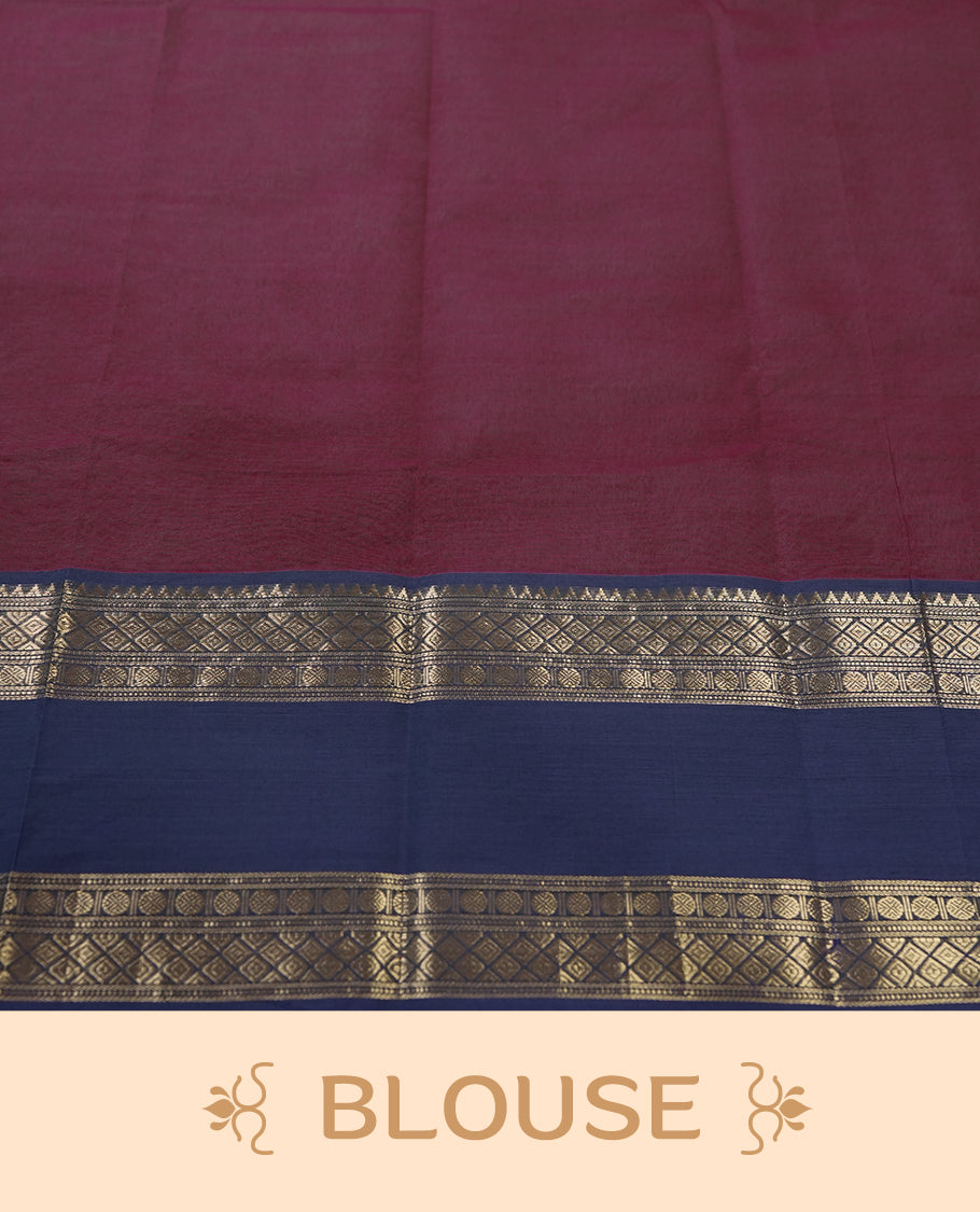 Maroon colour pure Kanchi cotton saree featuring with delicate golden checks on body, paired with a contrasting navy blue zari woven border & Includes a matching blouse piece for a complete look.